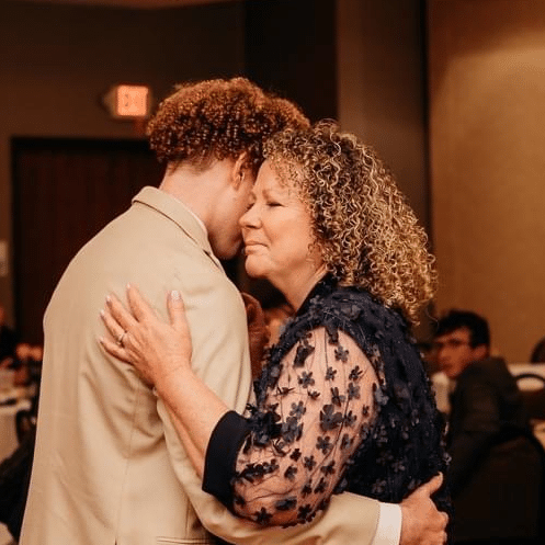 Toni Becker with Jack at a wedding reception